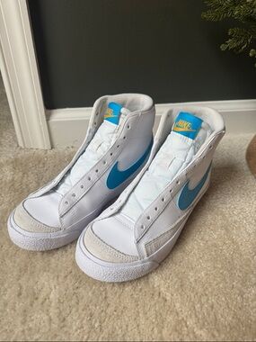 Nike White High-Top Sneakers with Blue Swoosh